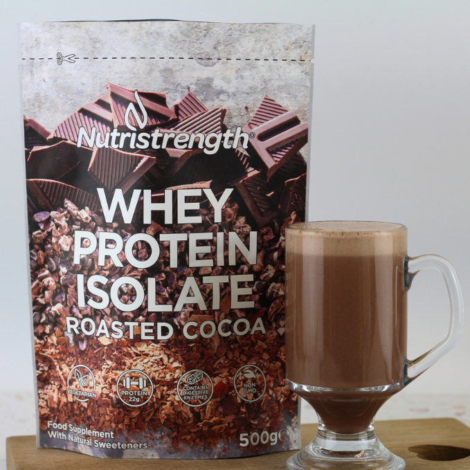 Nutristrength Chocolate Whey Protein Isolate in it&#39;s new home-compostable pouch next to a high protein chocolate protein shake